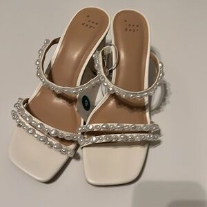 a new day Stacy cream mule heels with pearl-like strap details